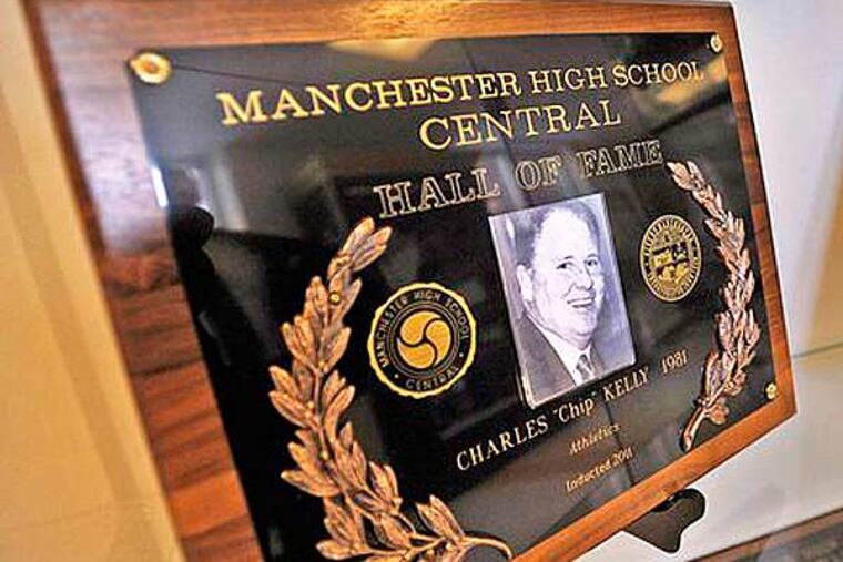 Chip Kelly's school hall-of-fame plaque is seen on display a trophy case at Manchester High School Central. (Photo by: David Lane/Union Leader)