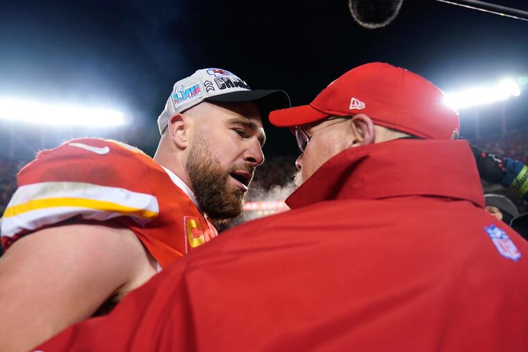 Kansas City Chiefs tight end Travis Kelce embraces coach Andy Reid after the AFC championship game.