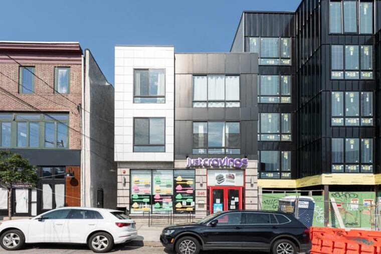 The bi-level condo (left) has a spacious floor plan for the area, 2,367 square feet, with an open layout living and dining area on the first floor with a side bedroom usable as an office or guest room.