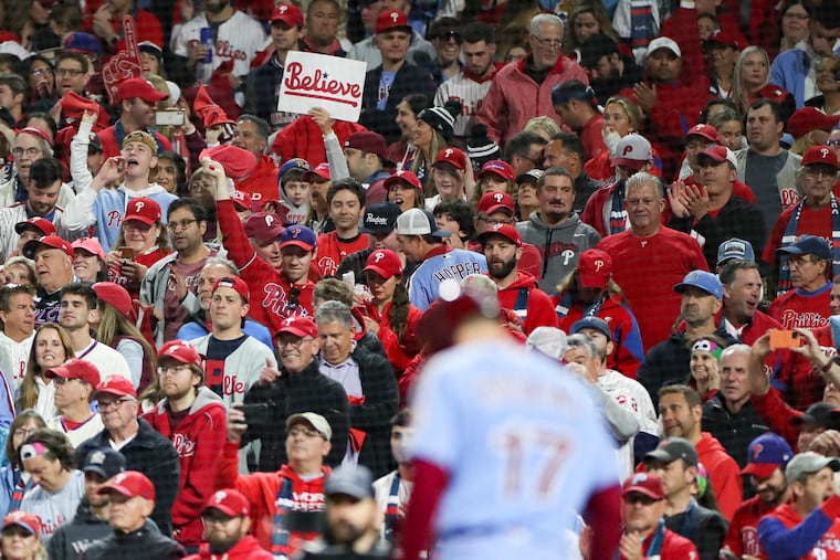 A Phillies fan holds up a “Believe” sign while Philadelphia Phillies first baseman Rhys Hoskins is at bat in Game 5 of the World Series against the Houston Astros at Citizens Bank Park.
