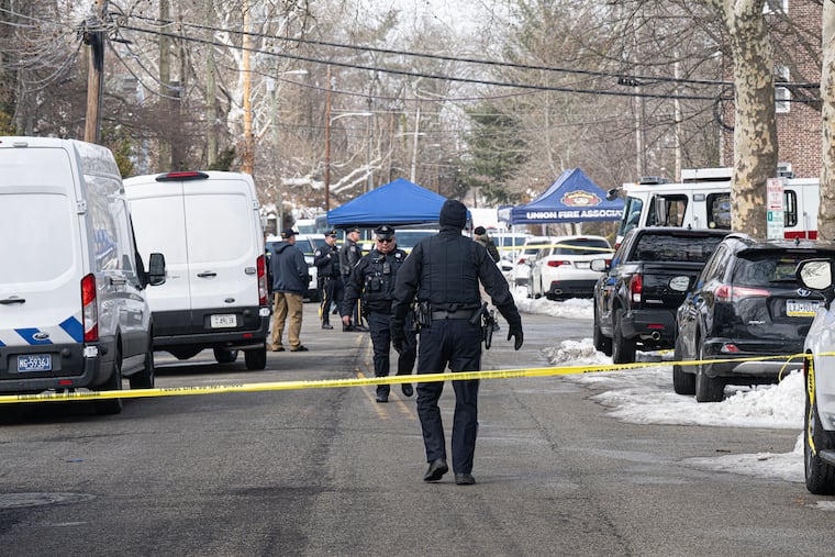 Police investigate the scene of a shooting near Edgehill Court apartment complex on Feb. 25. Francis Collier was shot by Lower Merion officers there as he got into his car.