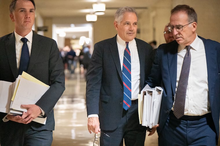 District Attorney Larry Krasner (center) outside the courtroom, at City Hall, in Philadelphia, on Monday.