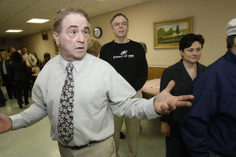 Democratic state Senate candidate Ann Dicker (right) waits in line to cast her vote yesterday.