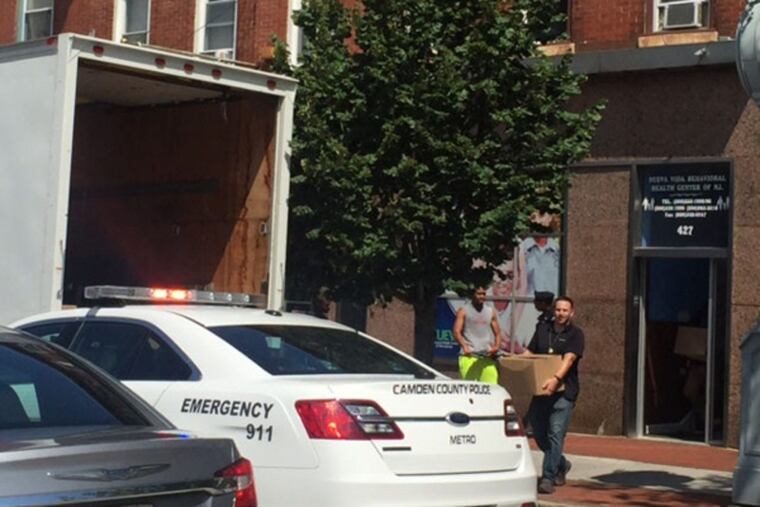 In this file photo, agents take evidence from the Nueva Vida Behavioral Health Center of N.J. in Camden.