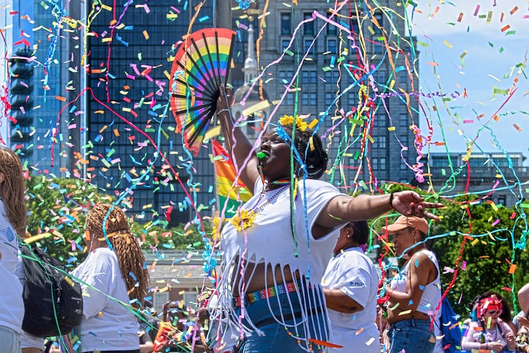 Jasmine Smith marches down Market street during, Philly's LGBT Pride Parade in Philadelphia Pa.The parade theme was the "Stonewall 50," in honor of the 50th anniversary of the Stonewall riots and the beginning of the LGBT rights movement.