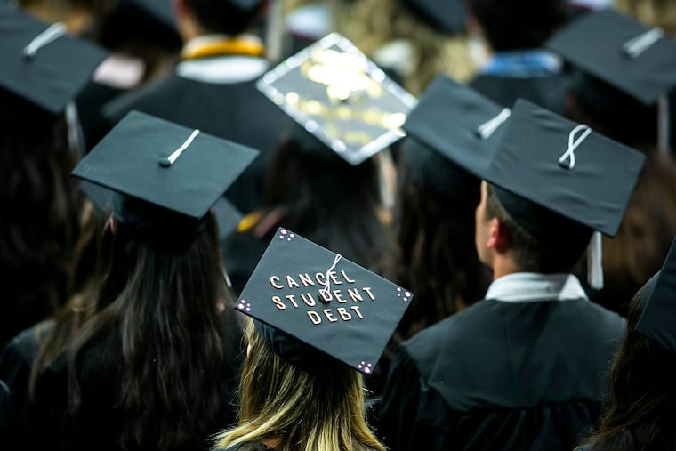 The cap of a University of Iowa graduates candidate is decorated with a message to "Cancel student debt" during a commencement ceremony for the College of Liberal Arts and Sciences in 2022. (Joseph Cress/Iowa City Press-Citizen via AP, File)