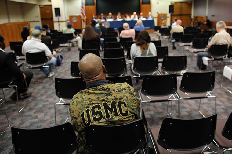U.S. Army and United States Marine Corp veteran William H. Thompas, wearing his U.S.M.C. jacket, listens from his seat in the audience during a town hall forum hosted by the Philadelphia's Veterans Affairs benefit office, Saturday, May 9, 2015, in Philadelphia. ( Joseph Kaczmarek / For The Inquirer )