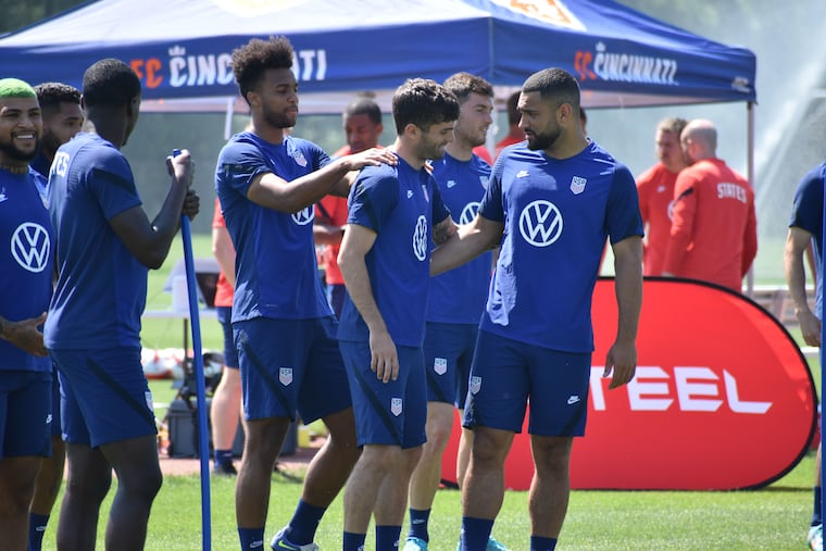 Hershey's Christian Pulisic (center) has some fun with teammates Erik Palmer-Brown (left) and Cameron Carter-Vickers (right) during the U.S. men's soccer team's practice in Milford, Ohio, near Cincinnati on May 31, 2022.