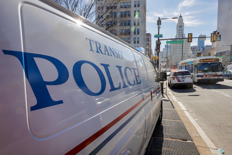 Transit police van on the sidewalk outside the entrance to Broad Street Line on northeast corner of N. Broad and Spring Garden.