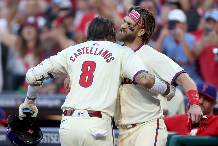 Nick Castellanos and Bryce Harper celebrate after Castellanos hit a solo homer against the Mets during the sixth inning in Game 2 of the NLDS on Sunday.