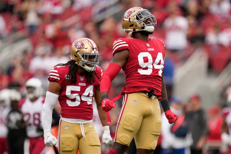 San Francisco 49ers defensive end Charles Omenihu (right) was arrested Monday following domestic violence allegations. He was released on bail.