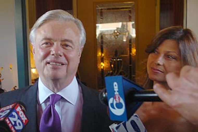 Vince Fumo and fiancé Carolyn Zinni greet reporters outside their party in South Philadelphia. (Sarah J. Glover/Staff Photographer)
