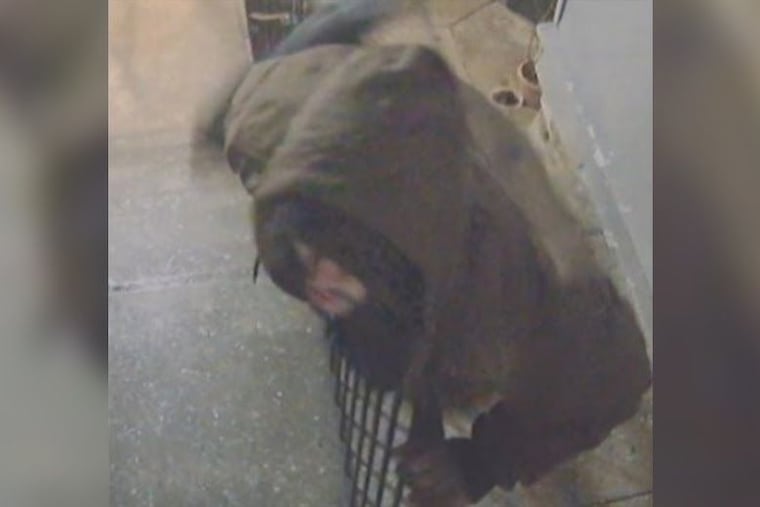 Philadelphia police are searching for a man they say tried to steal a package, then fired at the homeowner and a police officer as he fled.