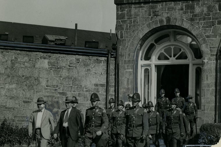 State police marching out of Eastern State after the riot on Sept. 26, 1933.