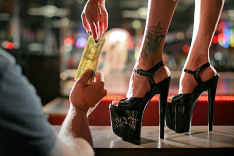 This photo illustration depicts a small but growing number of women awash in a lousy job market have turned to stripping in clubs or for bachelor parties to pay the rent, pay for school or feed their kids. (Craig Kohlruss / Fresno Bee / MCT)