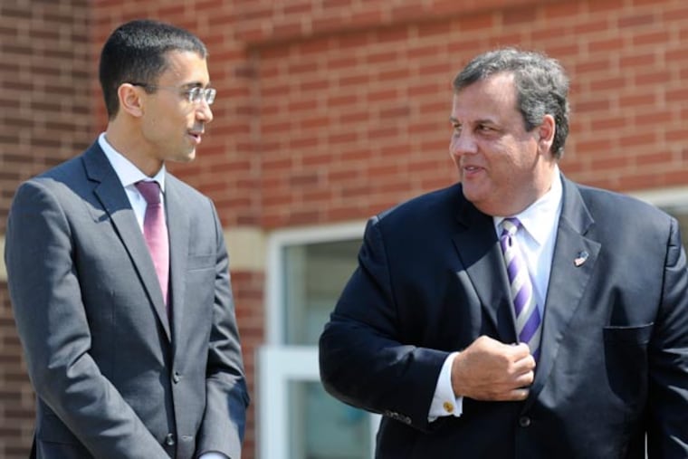New Camden school superintendent Paymon Rouhanifard and New Jersey Governor Chris Christie chat before his announcement as superintendent at H.B. Wilson Elementary School in Camden. August 21, 2013 ( RON TARVER / Staff Photographer )