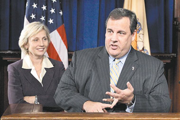 New Jersey Lt. Gov. Kim Guadagno looks on as Gov. Chris Christie addresses an audience Wednesday in Trenton, N.J. (AP Photo / Mel Evans)