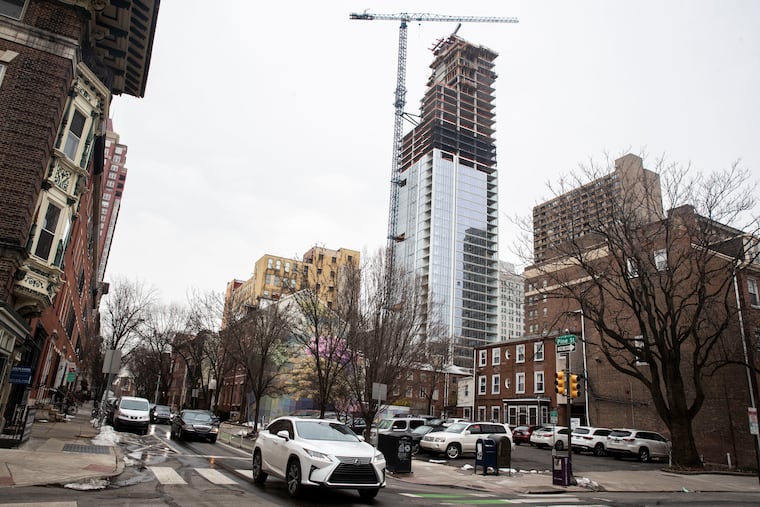 The Arthaus apartment building under construction on South Broad Street in Philadelphia in 2021, as seen from 13th and Pine Streets. The city is seeing more residential construction these days than the bordering Pennsylvania counties.
