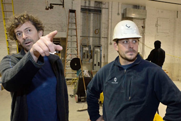 Evan Malone (left) of NextFab talks with Mike Bonacci, the construction supervisor overseeing NextFab's new quarters.
