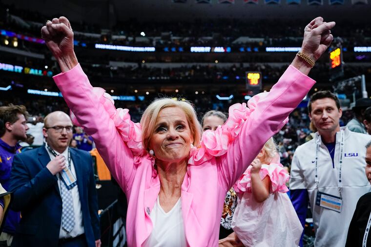 LSU head coach Kim Mulkey celebrates after her team's Final Four win over Virginia Tech on Friday.