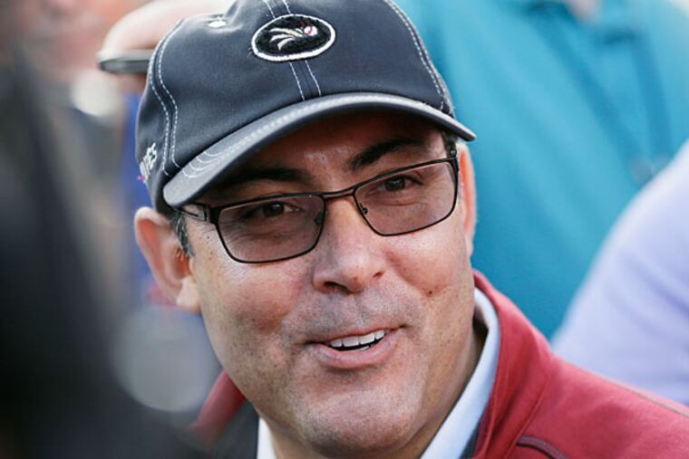 Ruben Amaro Jr. speaks to reporters before a spring training baseball practice Thursday, Feb. 13, 2014, in Clearwater, Fla. (Charlie Neibergall/AP)