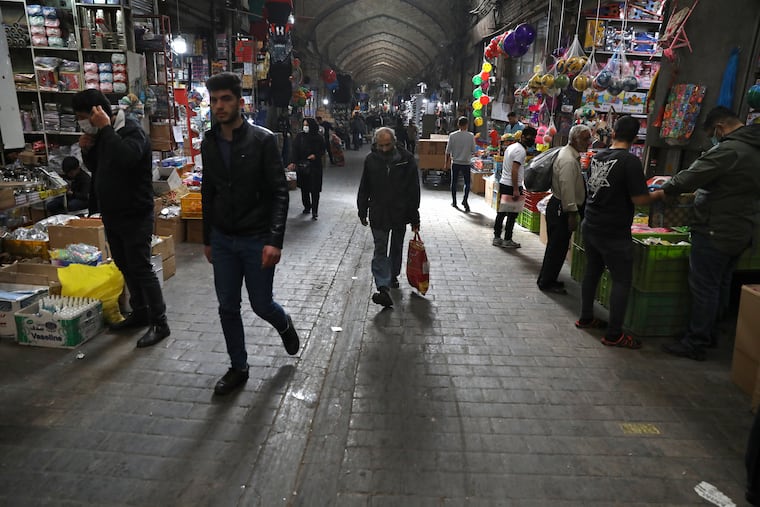 People walk through Tehran's Grand Bazaar in Iran. Some Iranians welcomed the election of Joe Biden as the 46th president of the United States as a beacon of hope for the future of their country already battered by the most severe sanctions in its history.