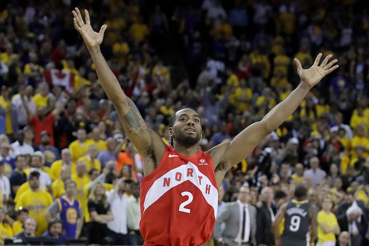 Toronto Raptors forward Kawhi Leonard celebrates after the Raptors defeated the Golden State Warriors in Game 6 of the NBA Finals.
