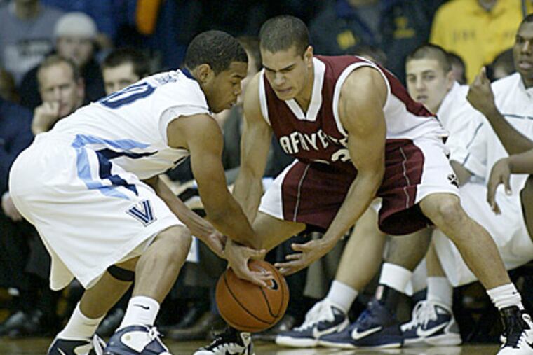 Lafayette's Les Smith, right, and Villanova's Corey Fisher fight for ball control in the first half. (AP Photo/H. Rumph Jr.)