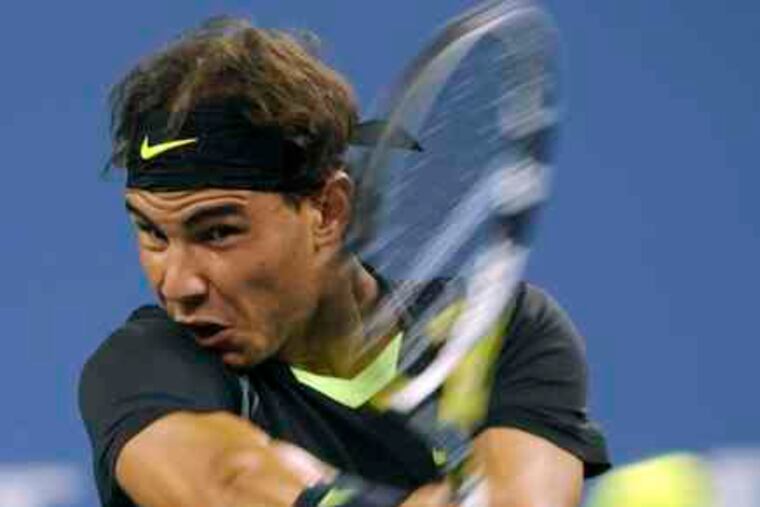 Rafael Nadal returns a shot to Teymuraz Gabashvili. Tuesday night's U.S. Open match ended too late for this edition.