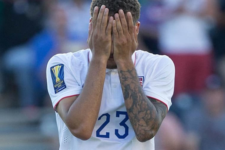 United States defender Fabian Johnson (23) reacts after missing his penalty kick in overtime against Panama in the CONCACAF Gold Cup third place match at PPL Park. Mandatory Credit: Panama wins on penalty kicks after a 1-1 draw. (Bill Streicher/USA Today)
