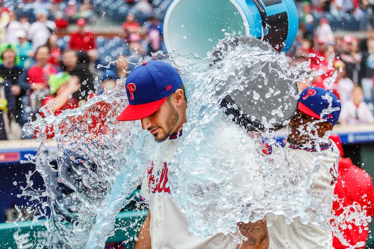 Zach Eflin gets a gatorade shower courtesy of Jean Segura.