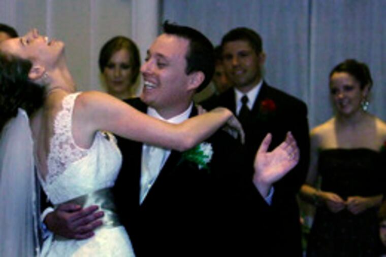 Melinda "Lucky Lynnie" and Paul share a laugh at the end of their first dance.