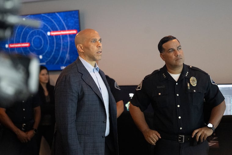 Sen. Cory Booker, left, speaks with Camden County Police Chief Gabriel Rodriguez during a visit to the department on June 12, 2026.