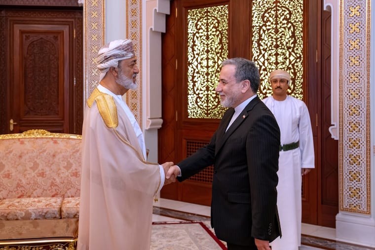 In this photo released by the Iranian Foreign Ministry, Iranian Foreign Minister Abbas Araghchi, right, shakes hands with Oman's Sultan Haitham bin Tariq during their meeting, in Muscat, Oman, Sunday, April 26, 2026.