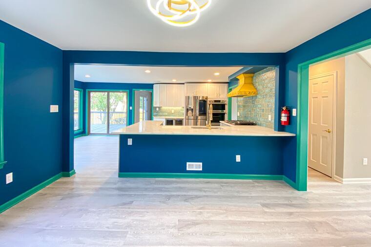 The house’s open floor plan joins the living room, dining room, kitchen and breakfast nook, and the deck has access to the kitchen and family room.