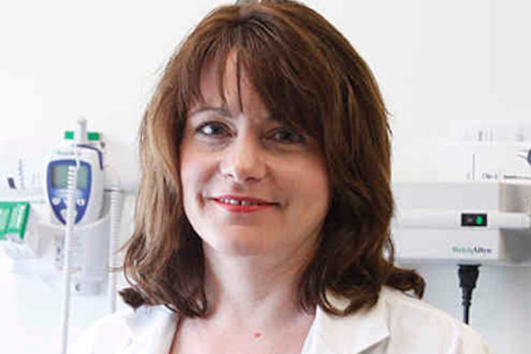 Dolores Grosso has a DNP . She doesn't call herself "doctor" around patients. "I don't feel the need to . . . have people think I'm either a Ph.D. or a doctor." (David Swanson/Staff)