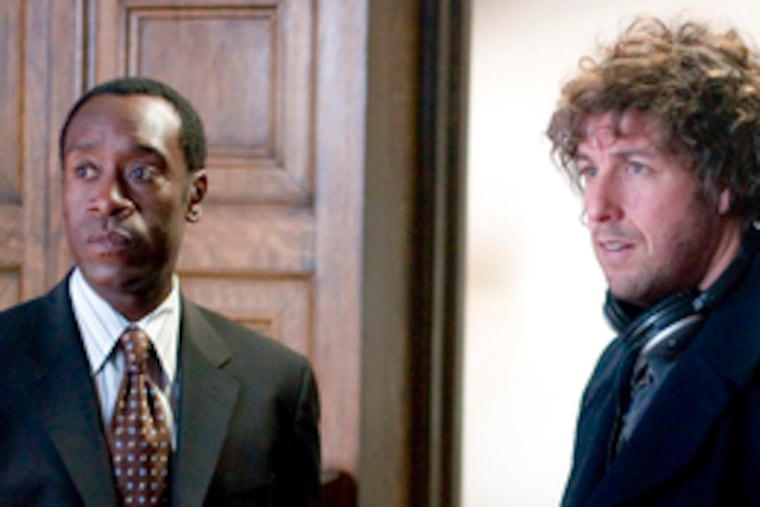 Don Cheadle and Adam Sandler star as a successful dentist and a haunted widower who reconnect in "Reign Over Me."