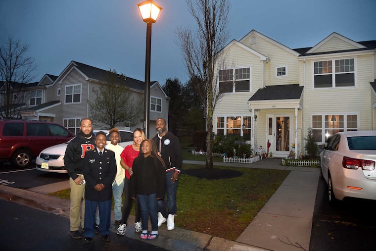 The Chamberlain family at their house in the Ethel Lawrence homes.