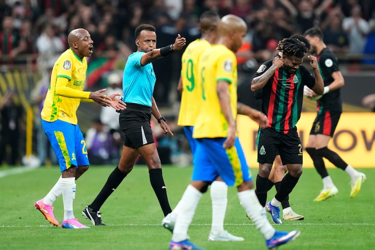 Omar Artan (second from left) refereeing an African Champions League game in March.