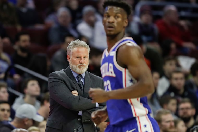 Sixers coach Brett Brown watching his team play the Miami Heat on Feb. 21.