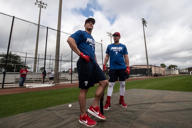 Phillies catcher J. T. Realmuto (left) and first baseman Rhys Hoskins during spring training.