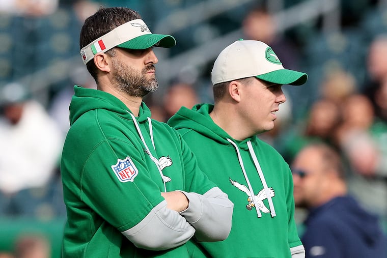Just one more regular-season game stands between Eagles head coach Nick Sirianni and offensive coordinator Kellen Moore (right) and the postseason. But who will they face?