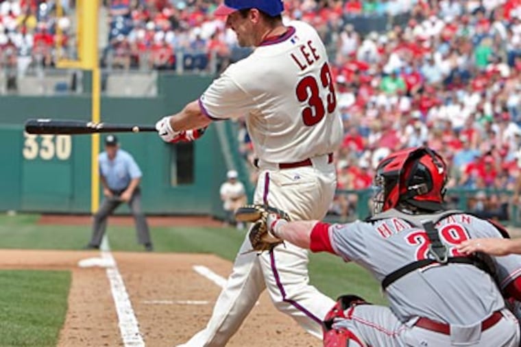 Cliff Lee knocked in three runs off of two hits against the Reds on Thursday. (David M Warren/Staff Photographer)