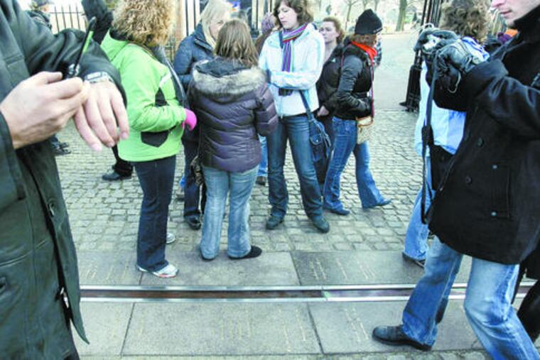 Time waits for no man, but will for a planet. A stitch in time will be added to keep clocks in sync with science. Above, the Greenwich Meridian Line in London.
