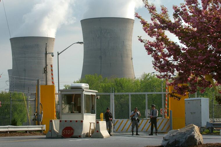 Armed personnel stand in front of the security gate leading to Three Mile Island nuclear power plant Wednesday, April 30, 2003, in Harrisburg, Pa. In 2003, the Rendell administration has halted daily patrols by the National Guard and state police at Pennsylvania's five nuclear reactors.