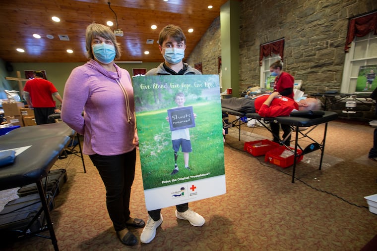 Peter Zucca with mother Dawn Zucca at Towamencin Mennonite Church, 1980 Sumneytown Pike, Lower Salford Township, PA on Thursday morning February 25, 2021. Peter Zucca survived cancer as a child and now has the Peter Powerhouse Foundation to improve the lives of children that are currently fighting childhood cancer. In 2020 the foundation held over 40 blood drives and collected over 4,000 units of blood.