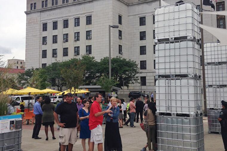 Roosevelt Plaza Park, a $30,000 place-making project opens in Camden. The space has seating, motion-detected light installations and a piano for public use through December. (Julia Terruso/Staff)