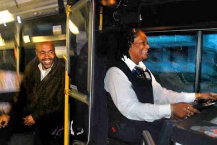 Rider Vincent McNeill talks with driver Evelyn Holley on his early morning commute from 40th Street and Westfield Avenue to downtown Camden. (Tom Gralish / Staff Photographer)