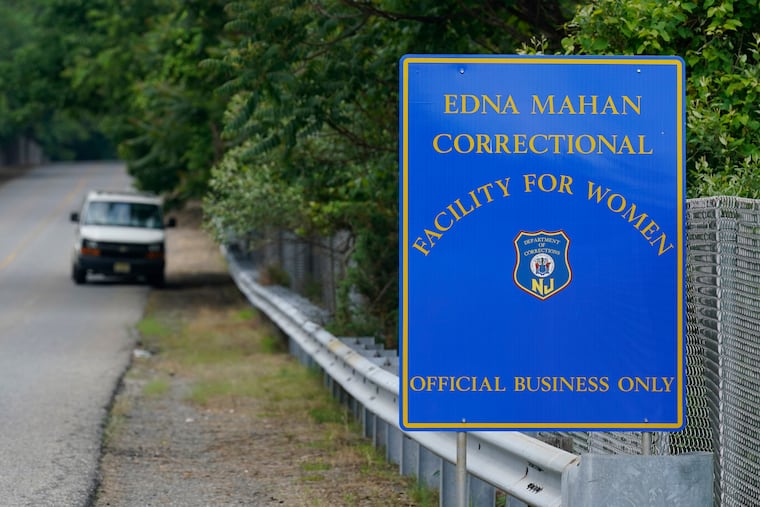 FILE - In this June 8, 2021 file photo, a sign is displayed near the Edna Mahan Correctional Facility for Women in Clinton, N.J. A male corrections officer at New Jersey's long-troubled and only women's prison has been charged with sexual assault and official misconduct stemming from a September incident with an inmate, the state's top law enforcement official said Wednesday, Oct. 13. (AP Photo/Seth Wenig, File)