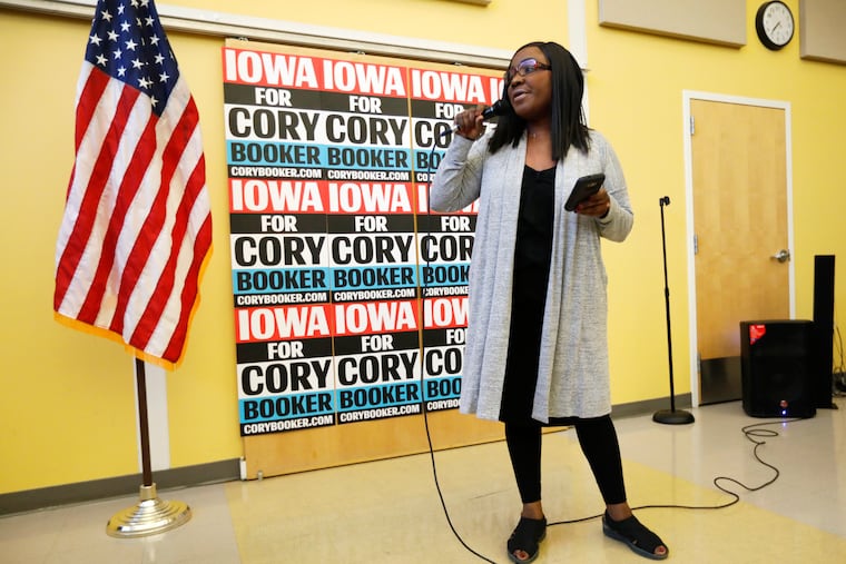 Former chairwoman of the Iowa Democratic Black Caucus Jamie Woods introduces Democratic presidential candidate Sen. Cory Booker to speak during the Iowa Democratic Party Black Caucus Reception, Tuesday, April 16, 2019, in Des Moines, Iowa. In Iowa _ that’s right _ black Democrats are more energized than they’ve been since Barack Obama’s 2008 presidential campaign and are poised to make a mark on the 2020 race. (AP Photo/Charlie Neibergall)